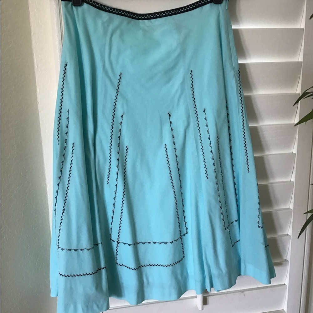 Blue circle skirt with black details